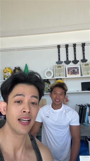 Cambodian performer shows off the khaen (a type of bamboo mouth organ), but doesn't play it, just...