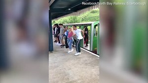 Kylie Minogue performs the Locomotion on a train in Scarborough