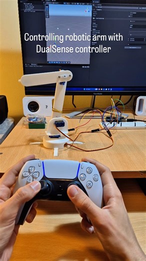 @eleven.cpp on Instagram: "When you take 'simulation games' a little too seriously... 🎮🤖 ​I used Unity Game Engine to bridge the gap between my PS5 controller and this robotic arm. It translates the joystick data to the hardware instantly, controlling reality just like a video game character! #robotics #unity3d #ps5 #arduino #gamedev"