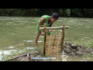 Primitive Technology Trap Fishing by bamboo - Survival Skills catch fish By hand in Muddy Water
