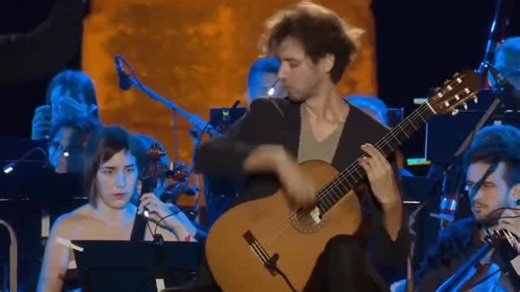 Benny on Instagram: "2018 live performance of the Adagio from Joaquín Rodrigo’s Concierto de Aranjuez, featuring cellist HAUSER and guitarist Petrit Çeku with orchestra in Croatia’s ancient Pula Arena, capturing raw emotional intensity through intimate string interplay."