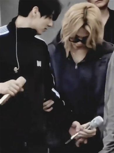 Jungkook Gives Mic to Jimin Across the Stage
