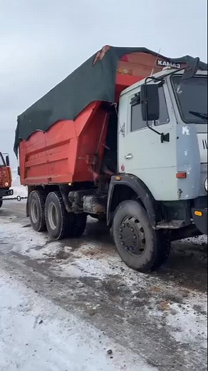 Mercedes and Kamaz Trucks on Snowy Road