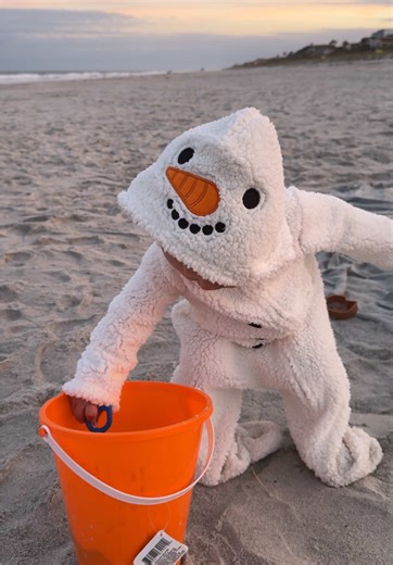 Creating the Sandiest Snowman at the Beach