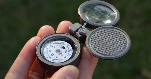 Tiny navigational multitool caches survival muscle on your keychain