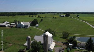 Pennsylvania Amish rural community farm green house carriage pull. Settled late 1700's as pioneer religious settlement. Old Mennonite town. Rural old order. Farming horse driven equipment.