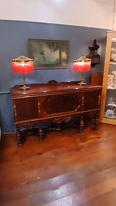 1920's Jacobean Tudor Revival dining set: table with six chairs, one leaf, and buffet. $1200. If sold separately: Table and chairs $795, buffet $695. Rare pair of Ocar Bach comedy & tragedy style lamps with original finials and hand-made embroidered sily shades with glass beaded fringe $695. Stunning 1920's print titled "Daybreak" by Maxfield Parrish in the original frame $325. | Orchid House Antiques