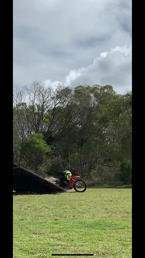 Motocross Rider Performs Stunt Off Truck Ramp