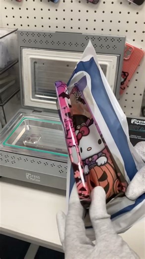 Love my Halloween kitty phone case! This machine makes phone case printing possible at 🏠