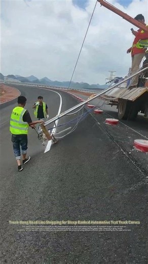 Ingenious Trick to Paint Lines on Steep Banked Test Track Curves Regular Stripers Can’t Handle