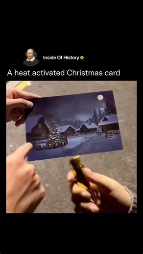 Inside Of History on Instagram: "The post features a 13-second video of a thermochromic Christmas card depicting a dark snowy village; applying heat from a butane lighter reveals hidden illuminated windows and tree lights, creating a “magical” glow effect that resets after cooling. Thermochromic inks in the card use leuco dyes that turn transparent at around 30°C, exposing underlying colorful prints; this reversible process, based on molecular structure changes, makes the card reusable and safe