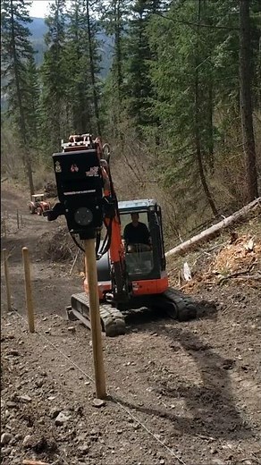 Driving Wood Posts on Uneven Terrain with Excavator - Vibe Drive MX Puma vibrating post driver