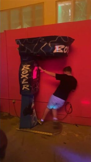 Man Headbutts Arcade Punching Machine and Falls Instantly