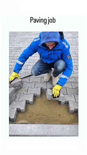memzkr on Instagram: "This instagram post captures a worker methodically installing interlocking concrete pavers on a sand base, using a mallet to tap them into place for a stable, seamless surface without mortar. Posted by Viralfizz , an account focused on construction footage, the clip has exceeded 4 million views in under a month, sparking discussions on efficient paving techniques. Viewer reactions question the deliberate placement order, revealing the puzzle-like aspect of interlocking pave