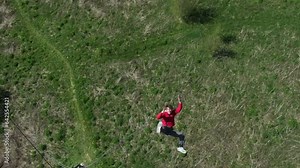 a guy falls from a height, a man falls, a man falls from a roof, slow motion