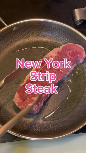 New York Strip Steak How to cook a perfect New York Strip Steak. This does assume you have a 2 inch thick steak. 1. Let the steak warm up on a plate at room temperature for about 30 minutes. 2. Pat dry and heavily salt and pepper the steak including the edges. 3. Heat up a pan with vegetable oil. You want the pan hot. 4. Sear the steak 2 minutes on one side. Use long tongs so you don’t burn yourself. Use a spatula to push down on the steak to ensure good contact. 5. Flip the steak and sear the s