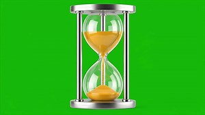 Hourglass with sand falling on green screen background.