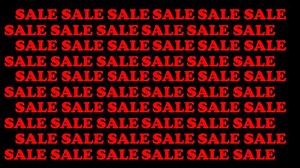 The inscription in red (sale). On a black background. Appears and smoothly disappears. There are a lot of labels on the whole screen (sale)