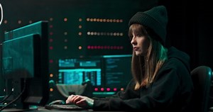 Nonconformist Teenage Hacker Girl Using Computer for Attacking Corporate Servers with malware.