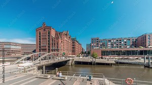 Panorama showing famous old Speicherstadt in Hamburg timelapse featuring the International Maritime Museum, iconic brick buildings, arch bridges, canals and waterfront. A historic landmark in Germany Stock Video