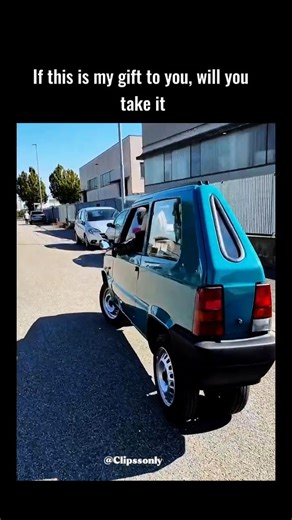 Trend on Instagram: "The post shares a viral video of the world's narrowest drivable car, a 50cm-wide electric Fiat Panda custom-built by Italian mechanic Andrea Marazzi from a 1993 model for navigating tight urban streets. Caption poses a playful dilemma about accepting the quirky single-seater as a gift, eliciting 130 replies blending humour—such as selling it for trading account funds—with appreciation for its unique charm. Video details reveal resourceful modifications, including a forklift