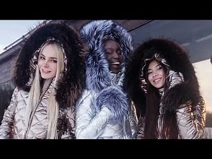 Girls in ski overalls and women's winter tight-fitting suits. Shiny winter overalls for women.