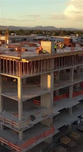 Work Goes Wild on Instagram: "Construction Floor Collapse Caught on Camera Workers barely escape as a concrete formwork fails on the upper floor of a construction site during the golden hour. The partial deck collapse sends debris and dust billowing while the crew evacuates to safety zones and emergency response is mobilized. #Shorts #Cinematic #Construction #ConstructionFail #SafetyFirst"