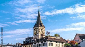 Zoom in time lapse of the bell tower of the church Saint Peter in Zurich with the largest church clock of Europe