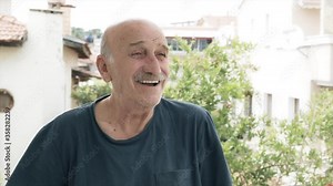 Happy, cheerful old man portrait in sunny time. Elderly senior is laughing, healthy old, mature person