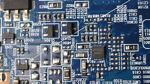 Computer circuit board close up, electronic technology background. Electronic components on a computer board.