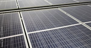 Expansive array of sleek solar panels arranged in rows. Designed to maximize sunlight absorption and enhance overall energy efficiency