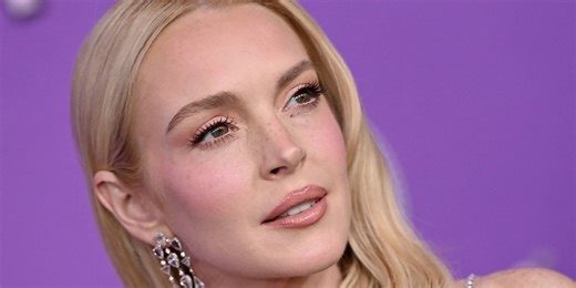 Lindsay Lohan Debuts a Dramatic Millennial-Coded Hairstyle While Wearing a Fuzzy Bathrobe