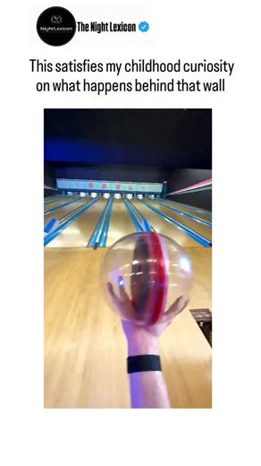 The Night Lexicon on Instagram: "The post shares a first-person video from inside a transparent bowling ball, rolling down the lane, striking pins, and entering the return pit, fulfilling the author's childhood wonder about bowling alley "secrets" like pin resets. Released on October 6, 2025, it drew 101k views and 239 likes within hours, inspiring Indonesian replies joking about the disorienting "life as a bowling ball." The footage exposes automated pinsetter mechanics-fallen pins swept into u