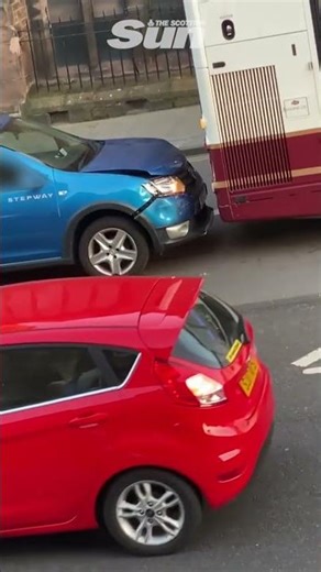 Shocking moment driver repeatedly smashes car into Edinburgh bus as baffled locals watch on