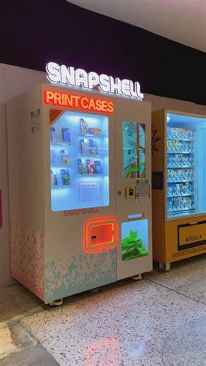 Giuseppe Mediati on Instagram: "COOLEST VENDING MACHINE IN ADELAIDE ⁉️ This vending machine in Adelaide allows you to make a custom phone case with any image on your phone. All you have to do is upload the image by scanning the QR code on-screen. Antonia and I’s cases turned out amazing, seamlessly printing our images on them. 📌 @snapshellau Vending Machine: City Cross, Rundle Mall, Adelaide SA 5000 #vendingmachine #machine #adelaide #adelaidecbd #city"