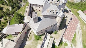 Aerial View Of Fort Queyras, Fortified Castle In Chateau-Ville-Vieille, Hautes-Alpes, France. tilt-up reveal, pullback