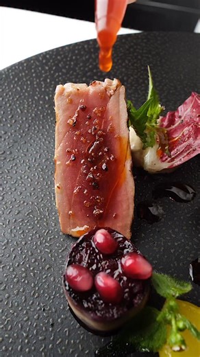 BLUEFIN TUNA Bellota Chorizo Grilled, wilted Trevisano radicchio, pomegranate, Saffron Potato, “Sauce Castillian” #restaurantdaniel | Restaurant Daniel