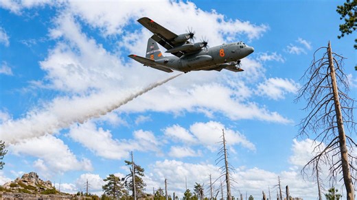 US aircrews train for wildfire season with water drops