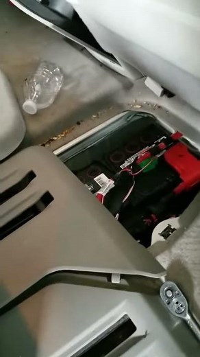 2008 GMC Acadia where the battery is located