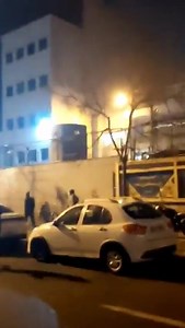 #IranRevolution2026: Oppressor forces of the regime’s Station 108 (Navvab), Tehran — Between 8 to 10 Jan, 2026 Newly circulated footage reportedly shows protesters attacking a police station and an IRGC-Basij base in the capital. According to reports from the scene of the clashes, security forces were firing at protesters from inside the building. #IranProtests | Iran Freedom