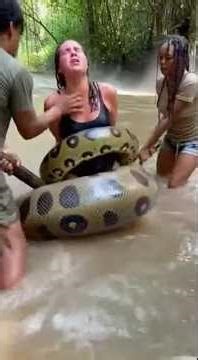 TERROR IN THE WATER: Giant Anaconda Coils Around a Woman