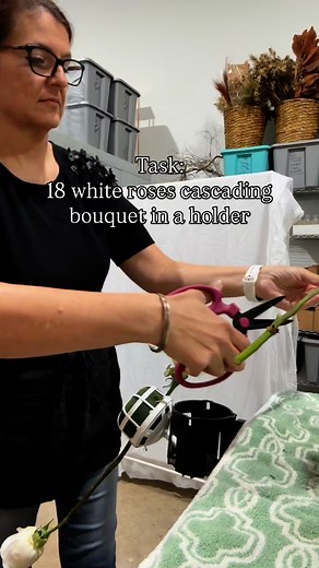 18 white roses. Traditional cascading bouquet. Sometimes I start with the greens. Sometimes I start with the roses This one was “mainly roses, accents of greens and fillers”. ❤️ | The Flower Studio Oxford