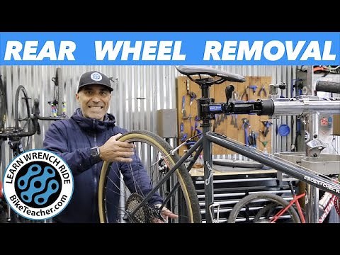 How to remove and replace rear bike wheel with a derailleur on a bicycle.