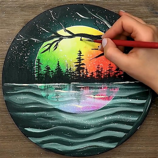 Magic Hands on Instagram: "🌙🌞 Day & Night in Circles | Magical Round Canvas Landscape Art | MagicHands 📝Welcome to MagicHands! ✨🎨 In this short 1-minute step-by-step art video, I create a magical round canvas artwork made of multiple circular layers, using acrylic paints, brushes, glitter, paper cut-outs and soft glow lights. 🌙 Outer Circle – Night Scene: The outer circle follows the natural shape of the canvas, featuring a tree that curves along the circular border, a calm light aqua-green