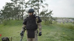 Army soldier removes mines, sapper with examines territory, minesweeper uses a mine detector