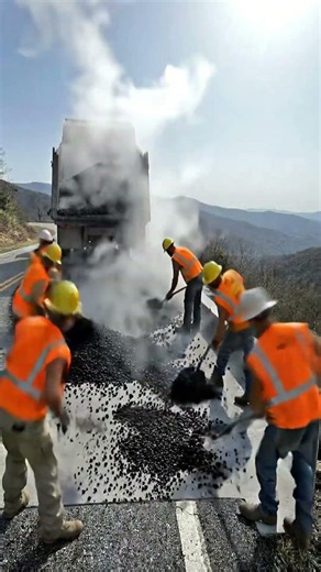 Repairing a road on a cliff under extreme conditions #Potholerepair #infrastructure #RoadMaintenance