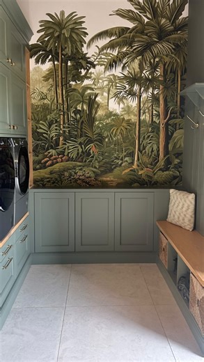 An everyday space, reimagined 🤍 Our Benmore Ridge mural transforms this utility into a tropical escape, layering depth and drama through its immersive tropical design. Framed by soft sage cabinetry and natural textures, it turns a functional room into a destination ~ a perfect balance of practicality and quiet luxury 🍃 | Graham & Brown