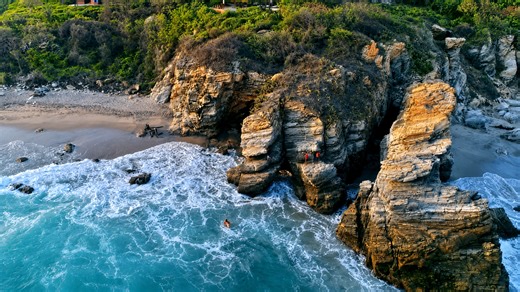 Massive waves crashing against Zicatela’s rocky coastline