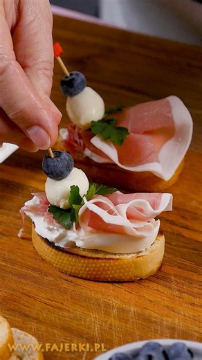 Elevate your party menu with these three creative and savory finger foods that blend classic flavors with gourmet presentation. This selection includes American-style mini sliders made with beef, cheddar cheese, and crispy bacon, all layered with fresh vegetables for a satisfying bite. You will also discover how to prepare elegant sandwiches featuring creamy burrata cheese and ham, uniquely garnished with mozzarella pearls and blueberries for a sophisticated finish. #recipeoftheday #recipeideas 