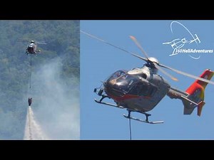 EC135 battling wildfire between the hills